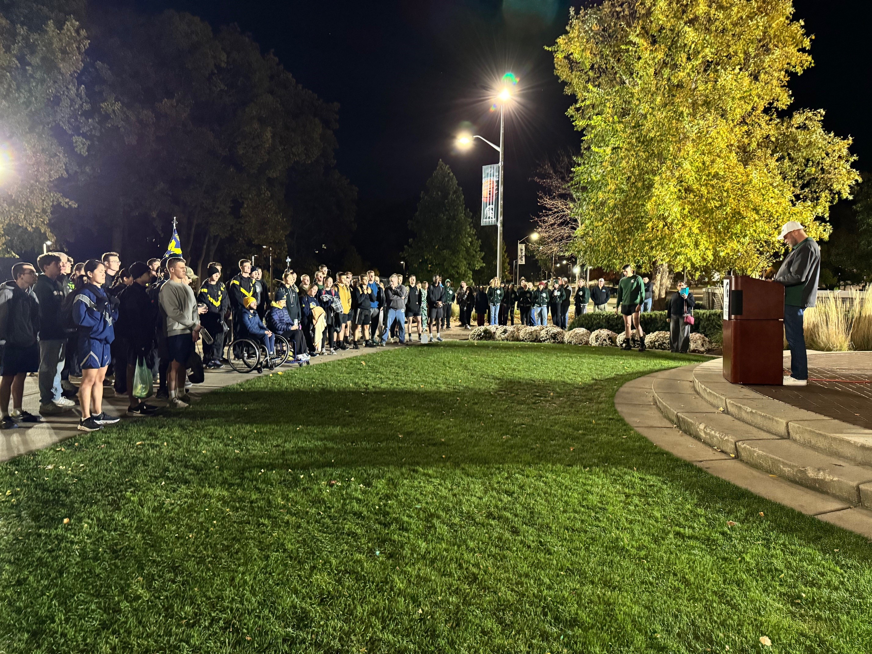 UM and MSU ROTC cadets standing together at the AGSR Launch ceremony with listening to speaker Provost Jeitschko; a side view