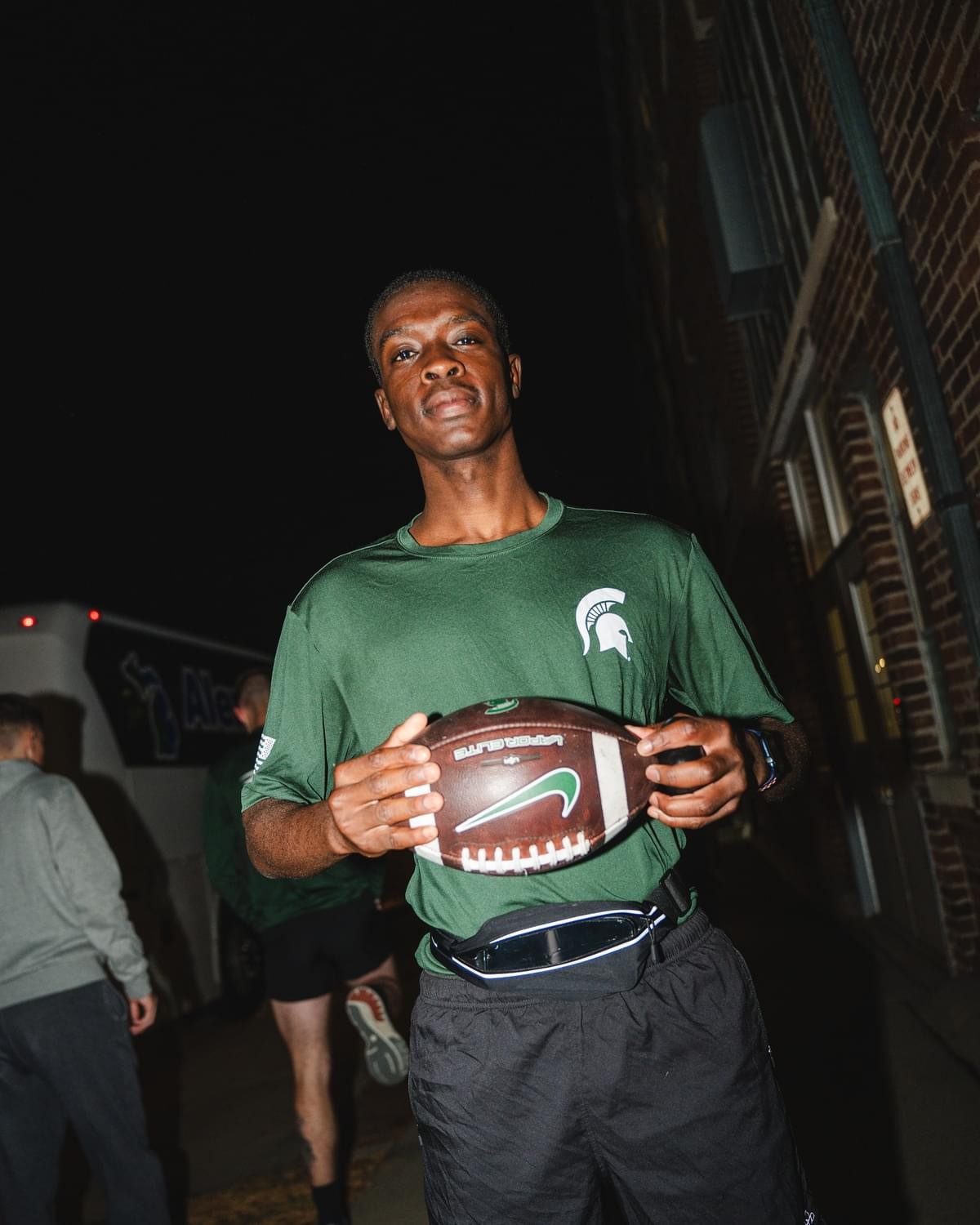 MSU Cadet holding a game ball