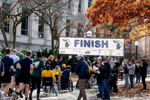 ROTC cadets crossing the finish line