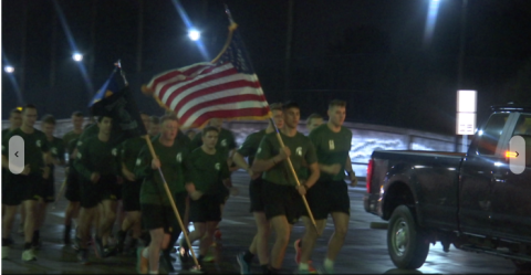 Army ROTC Cadets from MSU and UofM taking off at starting line in the rain at 3:00am in Ann Arbor